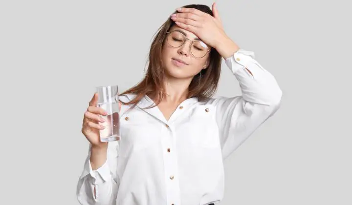 Woman touches her head