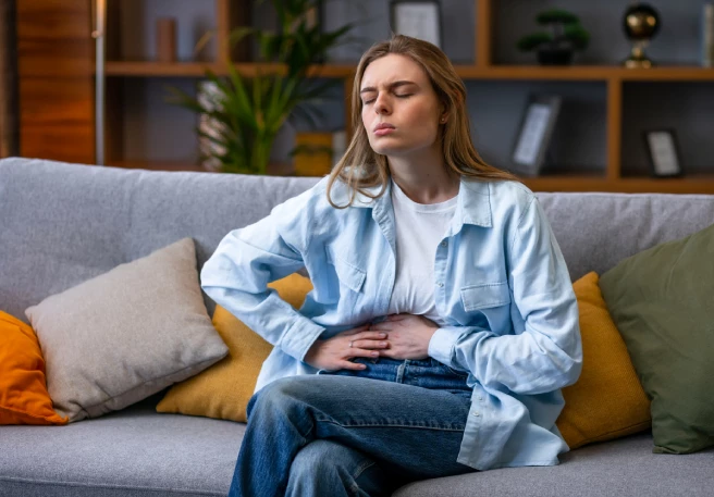 Man drinking tea with diarrhoea disease