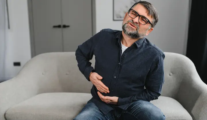Man suffering from stomach pain